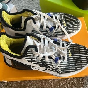 Nike Black and White Sneakers with Mesh Upper and Swoosh Logo